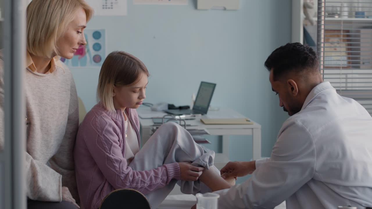 Doctor examining patient in clinic