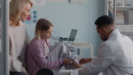 doctor examining patient in clinic
