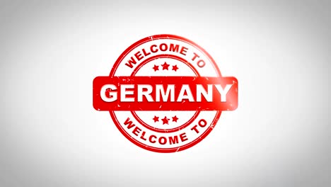 welcome to germany signed stamping text wooden stamp animation. red ink on clean white paper surface background with green matte background included.