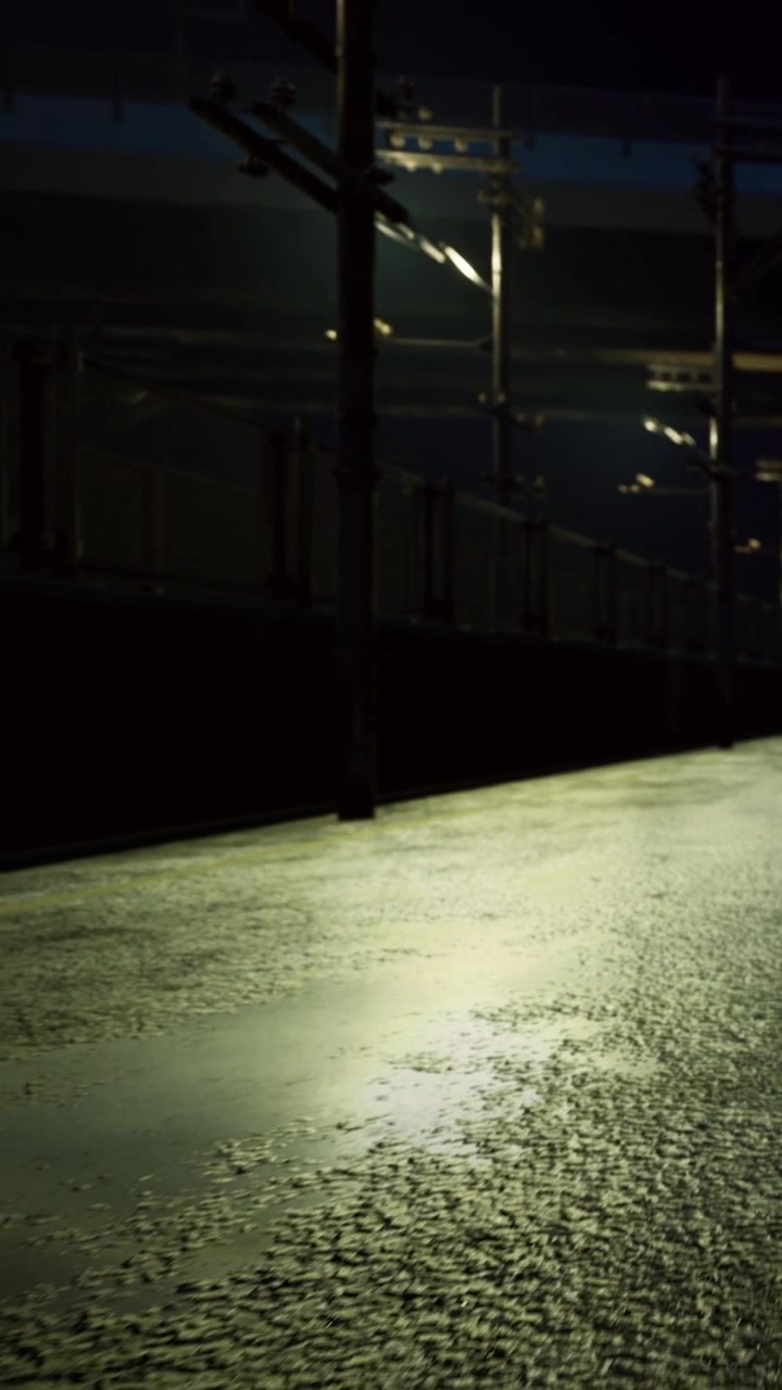 Empty street at night with reflections from nearby lights