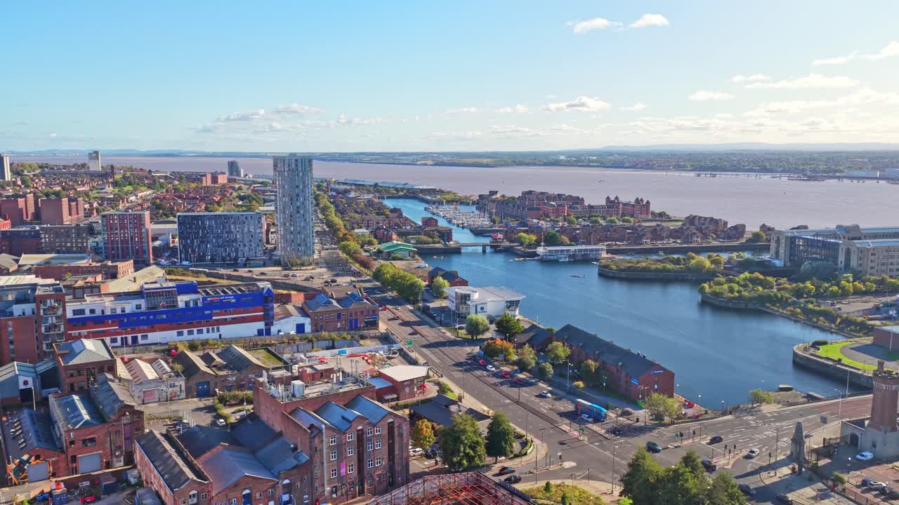 Stunning cinematic drone footage of Liverpool City Centre in northwest England showing the waterfront buildings and docks and boats