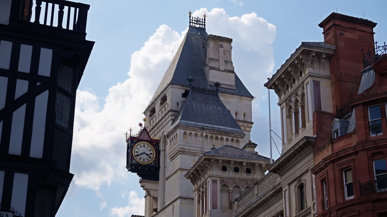 Street view of the clock tower and of the Royal Courts of Justice in London, England