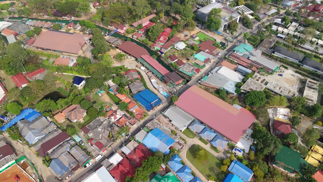 aerial drone footage of Kai Bae village on Koh Chang island with hotel accommodation and the ocean from a high angle