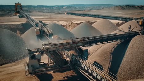 aerial view of a quarry with conveyor belts and aggregates