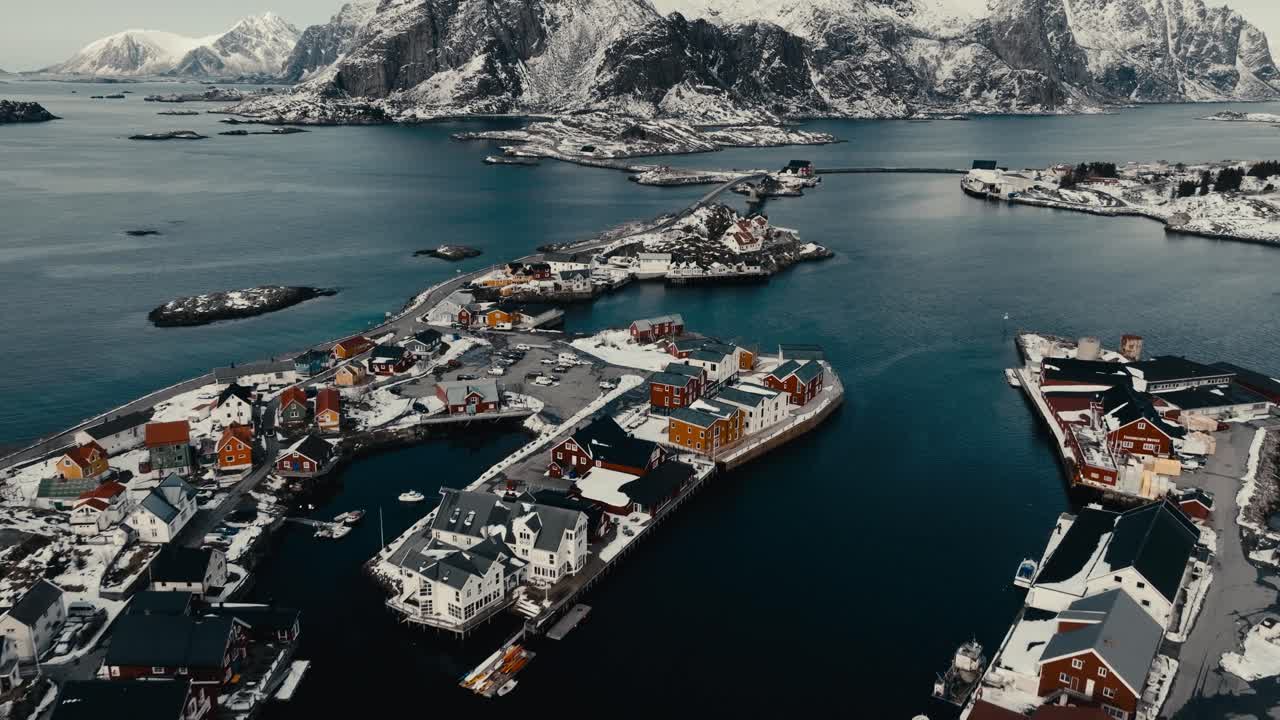Henningsvaer Village And Calm Blue Sea In Nordland, Norway. - aerial shot