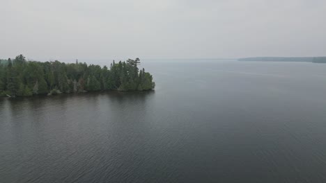 Atmospheric-Nature-Landscape-With-Calm-Sea-And-Forest-Trees-On-The-Islands