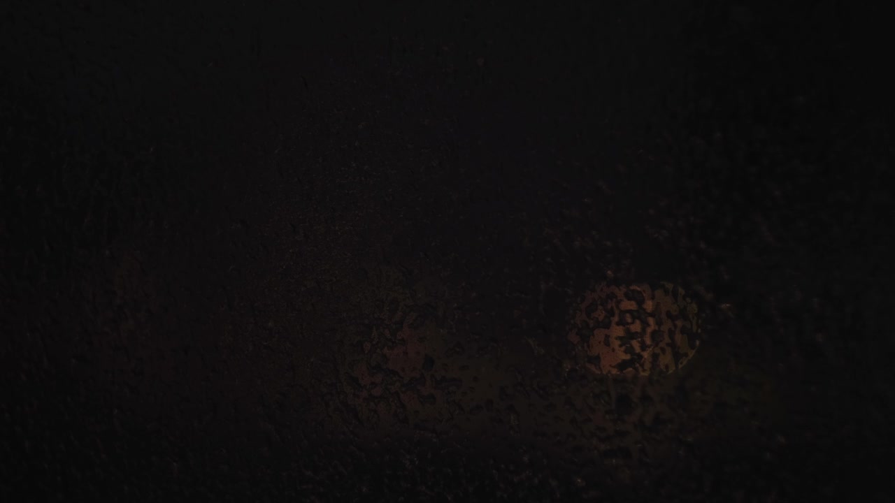 Dark, textured surface at night