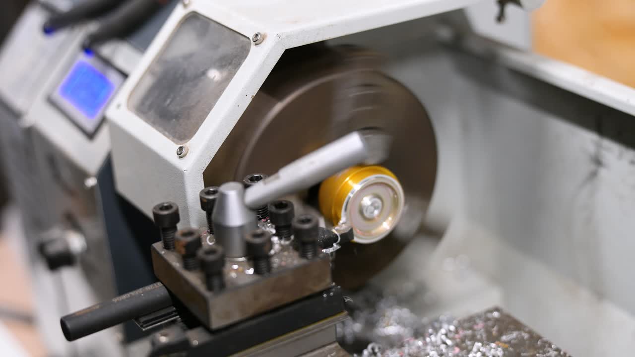 A close-up view shows a metal component being precisely machined on a lathe, with shavings flying. This industrial process highlights weapon modification at a drone workshop for modern combat