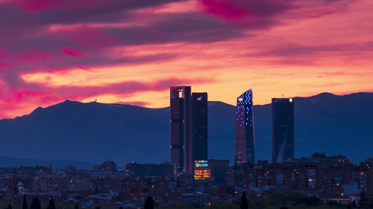 Timelapse of a beautiful sunset in Madrid. Madrid skyline, four towers bussines area as main subject.