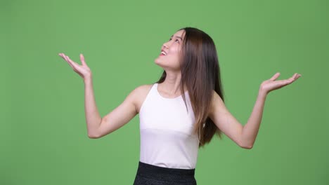 young beautiful asian businesswoman catching something