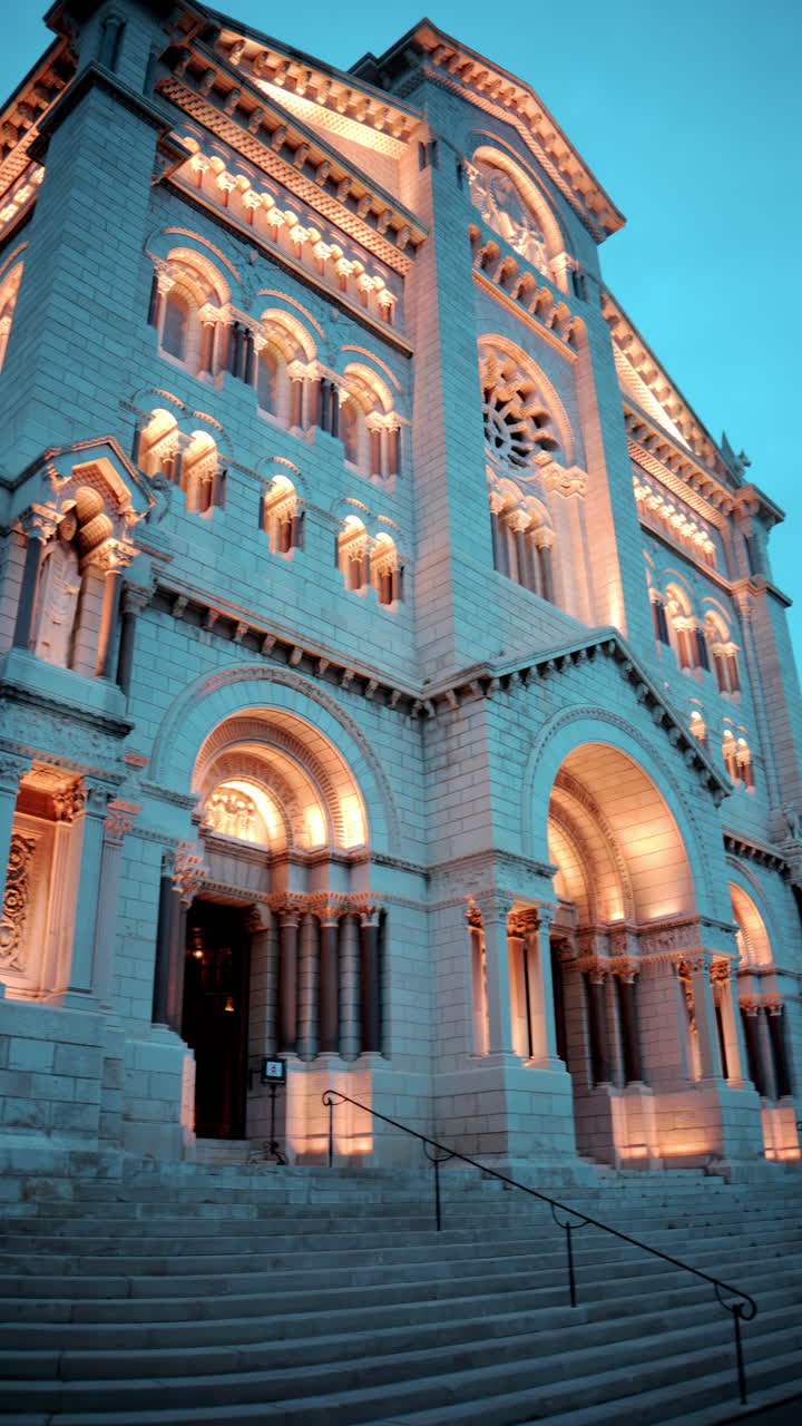 The facade of the Monaco Cathedral in the Old Town in the evening. Vertical
