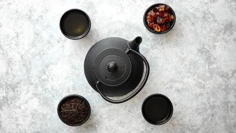 oriental tea set on stone table