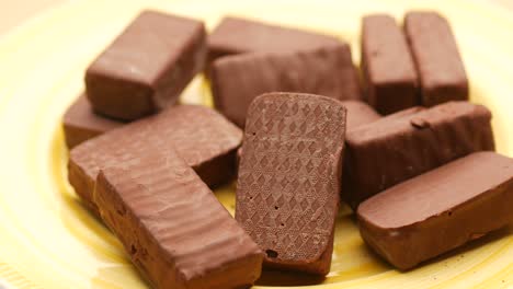 dark chocolate on a plate on table close up