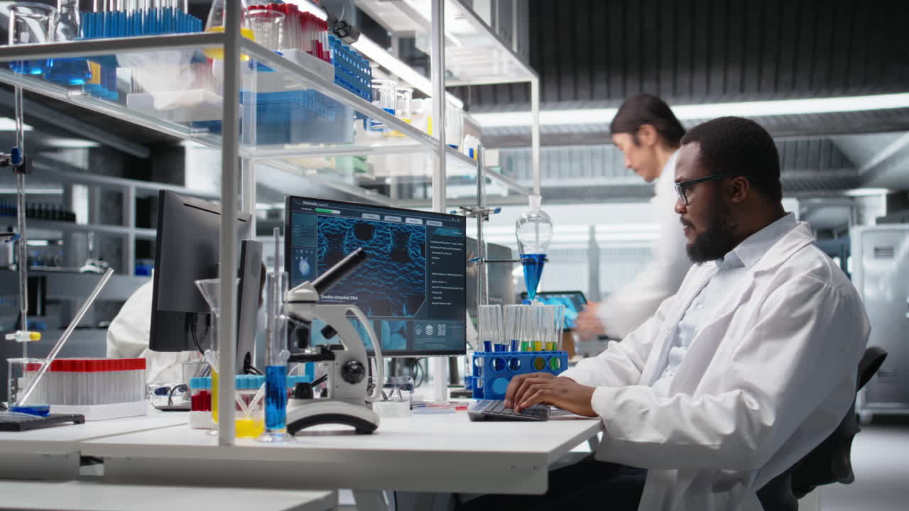 Vertical video Scientist using computer for DNA analysis driving treatment discovery