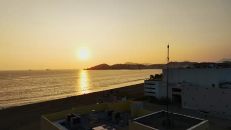 Breathtaking-Warm-Yellow-Sunset-Reflection-At-The-Santiago-Peninsula-In-Manzanillo,-Colima,-Mexico