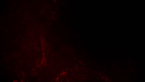 swirling red blood or other fluid moving and spreading slowly on black background