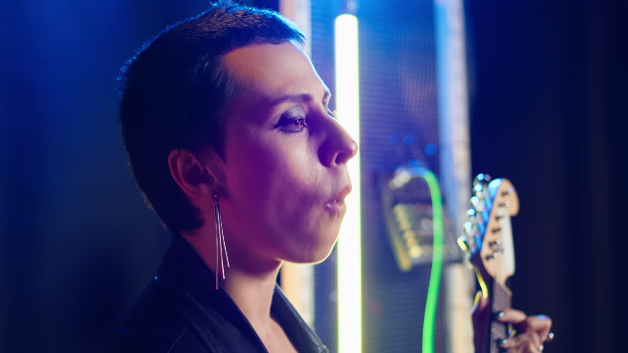 Woman Smoking with Guitar in Neon Lighting