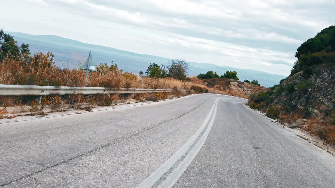 View from inside the car moving on a road, nature, Greece. Slow motion
