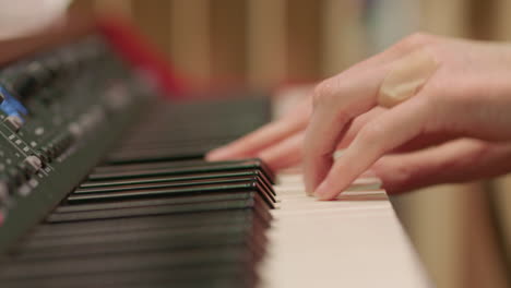 a pianist playing a keyboard