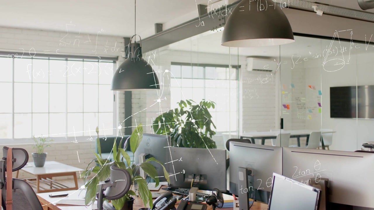 Skjematiske overlegg stiger fra lampe som dekker arbeidsstasjon, visualiserer teknologianalyse på skjermer