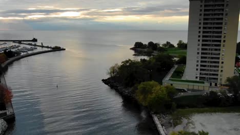 drone time lapse flying over mississauga harbor in early morning