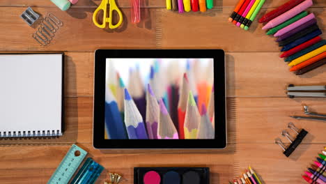 animation of a digital tablet showing multiple crayons on the screen