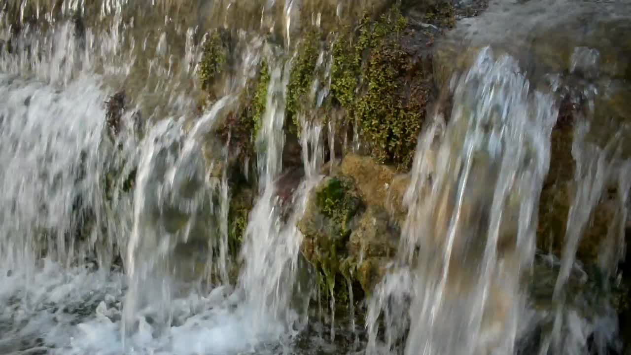 View of water flowing from a concrete creek