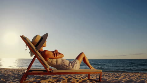 woman relaxing and enjoying serene moments on the beach at sunset