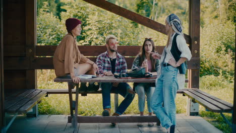 male and female friends talking while sitting on bench