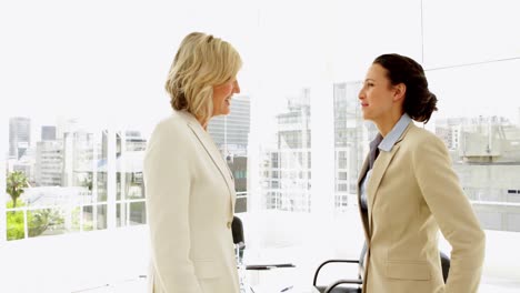 Happy-businesswomen-shaking-hands