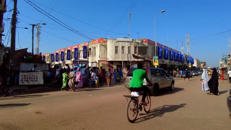 static plus left panorama of busy serekunda market street intersection