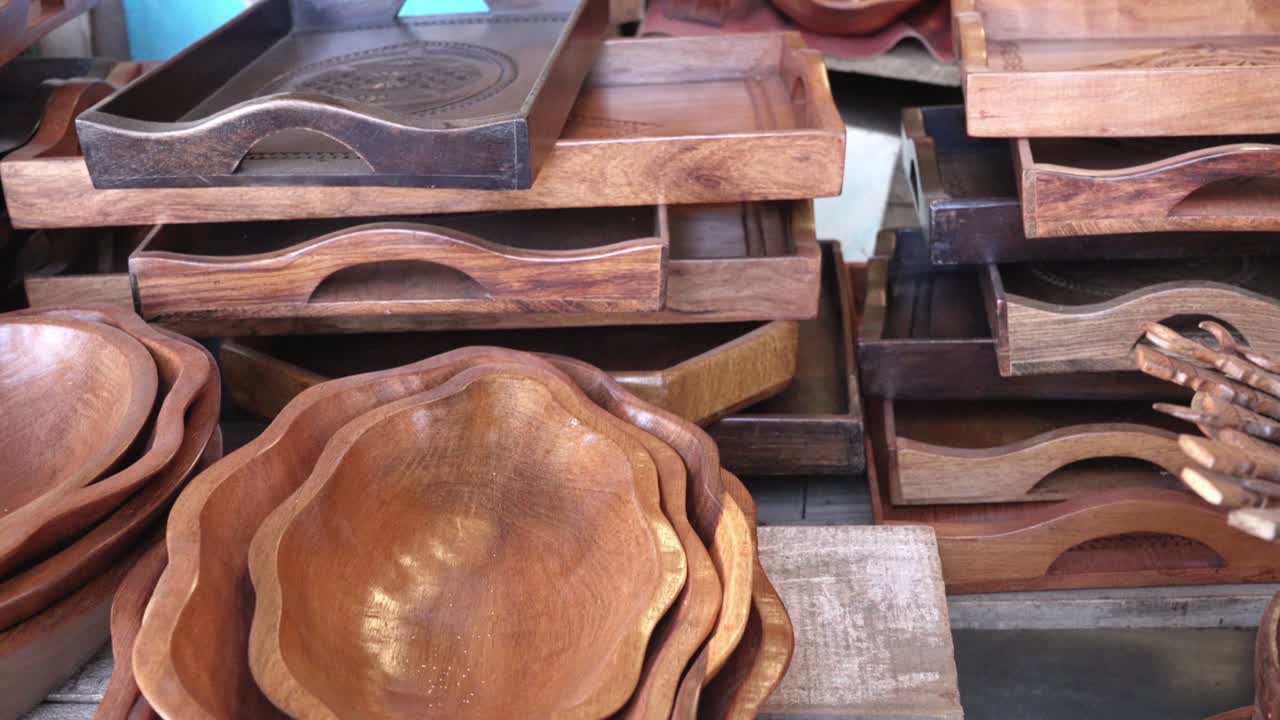 Variety of handmade wooden bowls, cups and trays on display at souvenir market in Antananarivo, Madagascar
