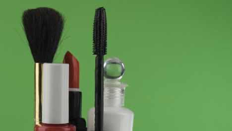 rotation of cosmetics on a green background