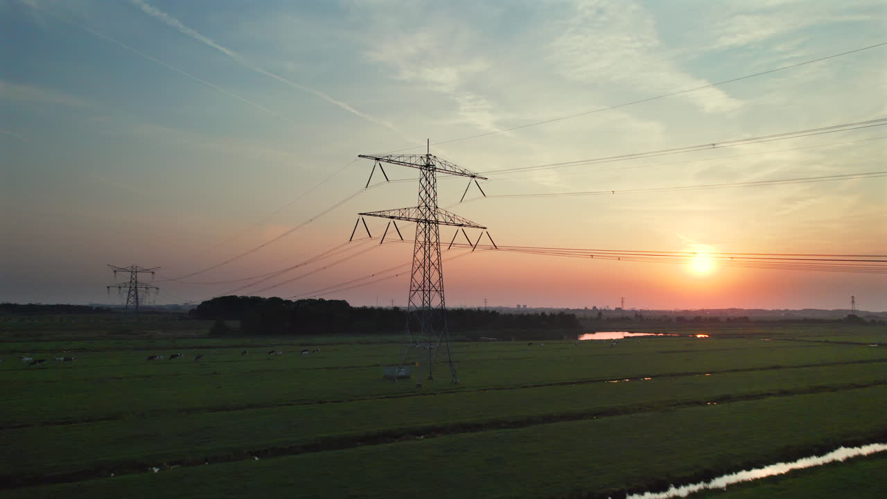 Transmission Tower By The Polders During Sunset In Stolwijk, Netherlands. - aerial shot
