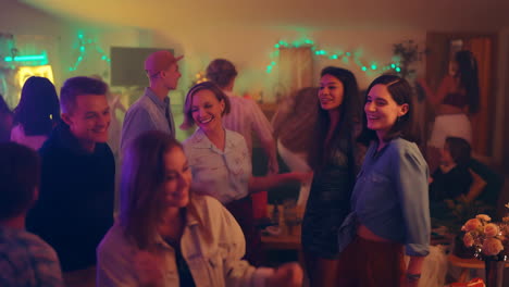 young adults dancing and socializing at a vibrant house party