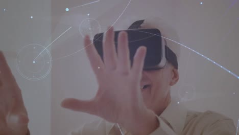 animation of network of connections over businessman using vr headset