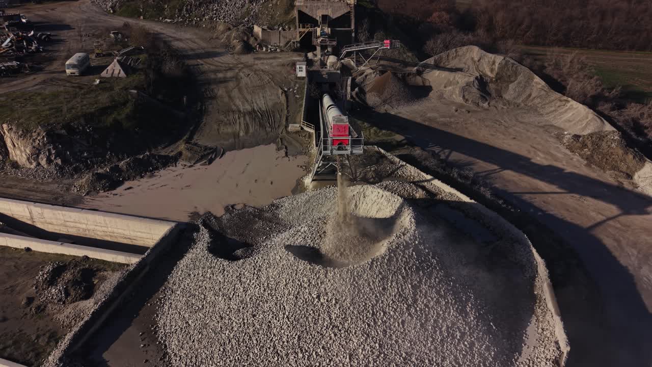 Quarry operations with conveyor belt transporting materials to storage