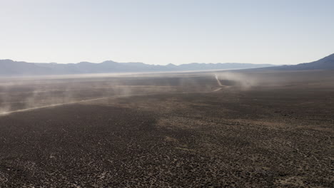 high wide drone aerial of vast nevada desert landscape with overland 4x4 trails