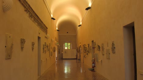 Beautiful-shot-of-the-aisle,-ceiling,-and-interior-of-famous-Malatestiana-Library-in-Cesena-in-Northern-Italy