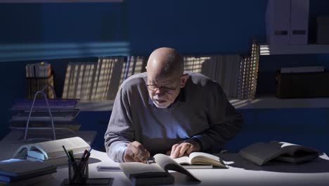 old man reading a book, researcher, historian, student, professor.