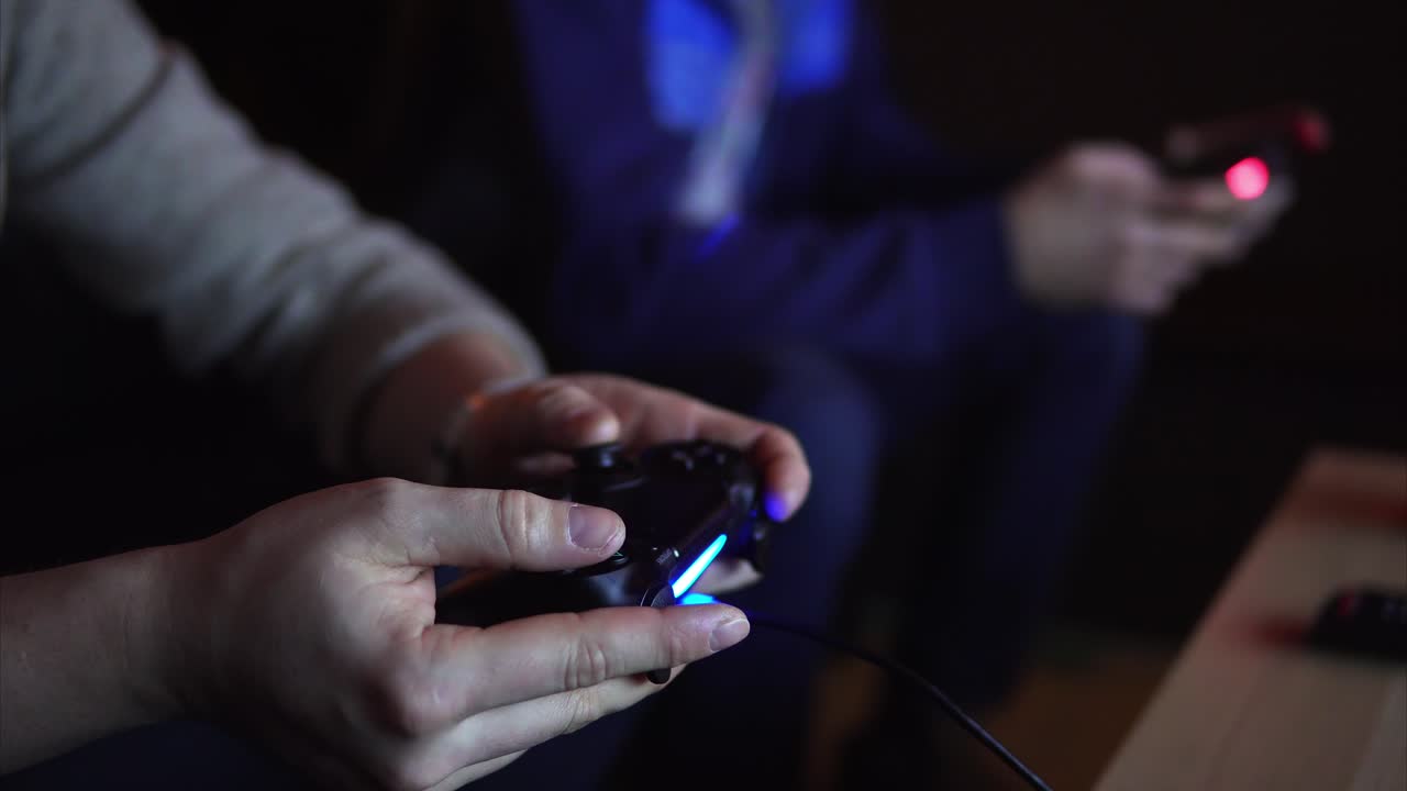 People playing video games at night