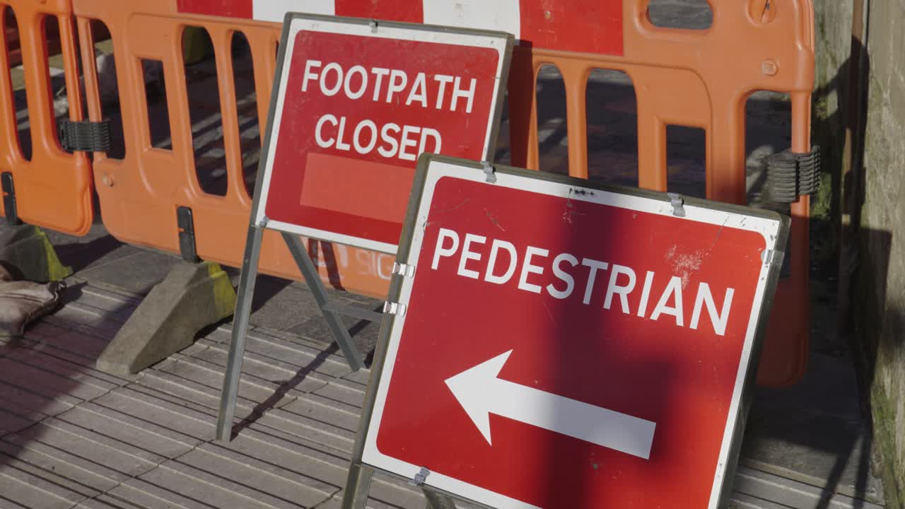 Pedestrian And Footpath Closed Road Signs Beside Construction