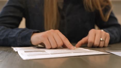 straight on shot of someone reading through all of the candidates in a local election