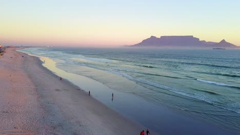 aerial view of sunset on cape town beach with table mountain in the background
