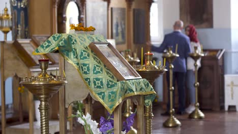 orthodox church interior with worshippers