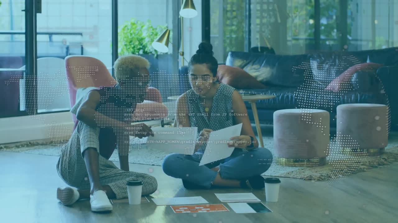 Animation of globe and data over diverse women working in office