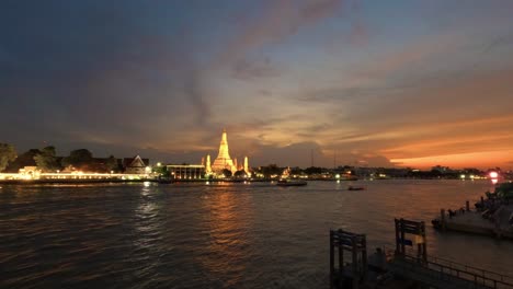 wat arun and cruise ships in twilight time, bangkok city, thailand