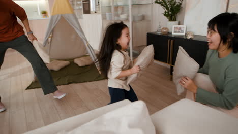 family fun: pillow fight in the living room