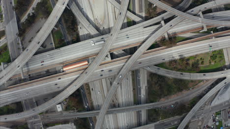 AERIAL:-Spectacular-Turning-Overhead-Shot-of-Judge-Pregerson-Highway-showing-multiple-Roads,-Bridges,-Viaducts-with-little-car-traffic-in-Los-Angeles,-California-on-Beautiful-Sunny-Day