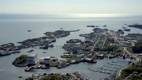 timelapse of svolvaer with boats, harbor, town center and ocean on a clear spring day in lofoten